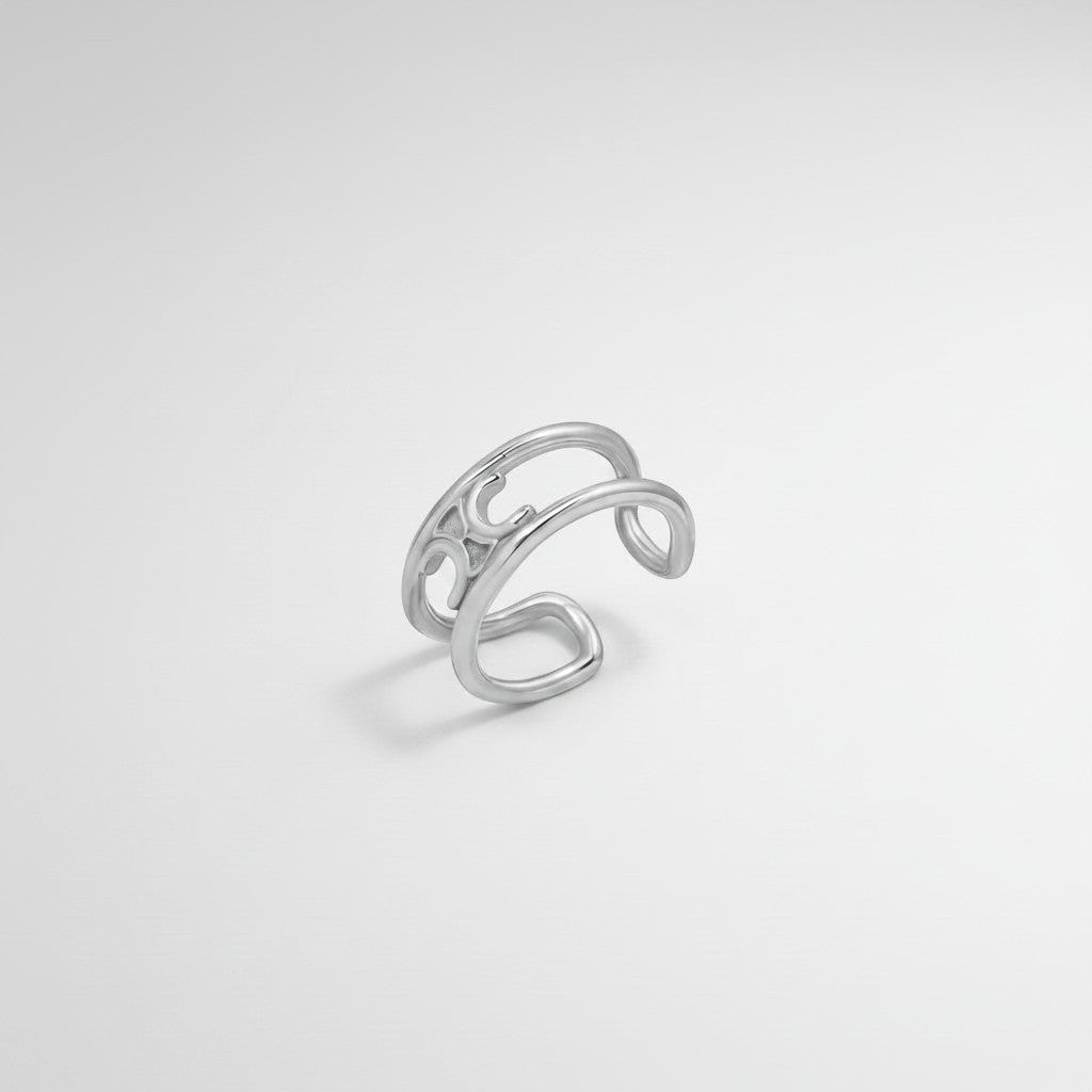 Bovenaanzicht van de ModaMelhor zilverkleurige open ring van titanium staal, waarbij het dubbele bandenontwerp en de open achterkant duidelijk zichtbaar zijn.