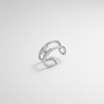 Bovenaanzicht van de ModaMelhor zilverkleurige open ring van titanium staal, waarbij het dubbele bandenontwerp en de open achterkant duidelijk zichtbaar zijn.